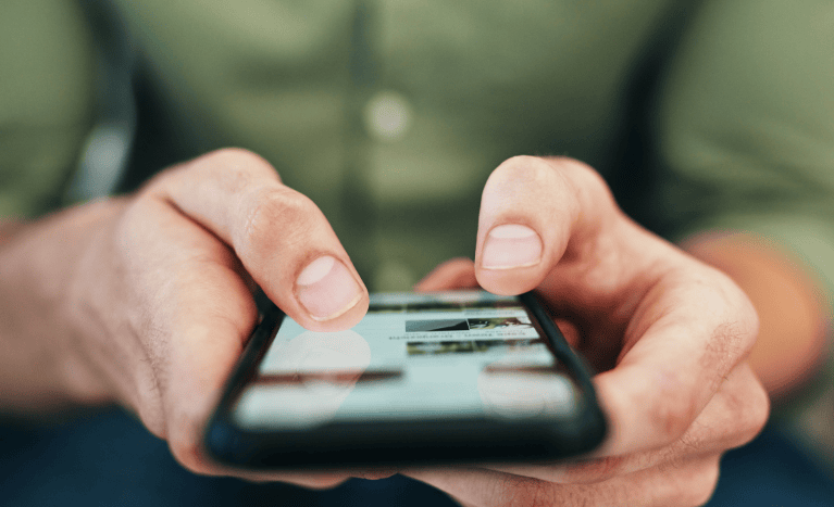 a man is surfing net on mobile